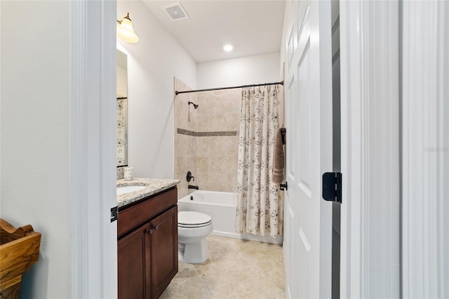bathroom featuring vanity, toilet, shower / tub combo with curtain, and tile patterned flooring
