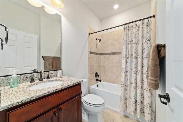 bathroom with toilet, shower / tub combo with curtain, and vanity