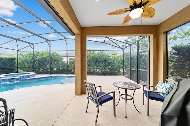 view of pool with a patio, a lanai, ceiling fan, and a pool with connected hot tub