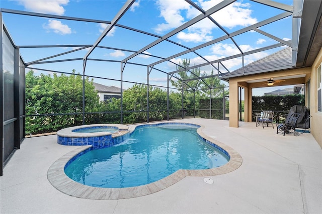 view of pool with a patio area, a pool with connected hot tub, a ceiling fan, and glass enclosure