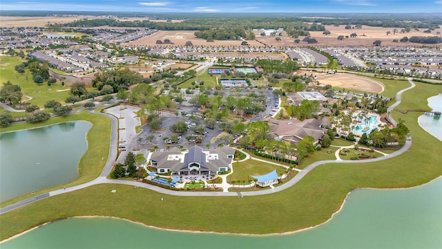 aerial overview of property's location with a large body of water and nearby suburban area