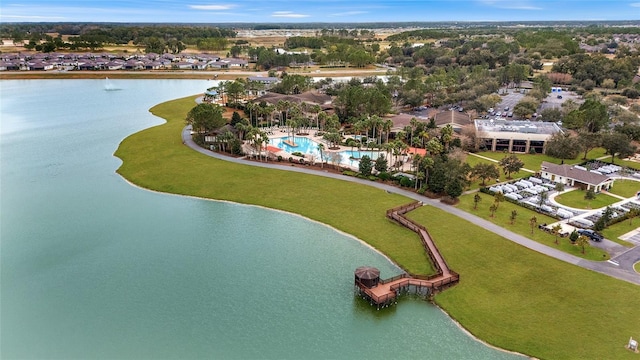 aerial overview of property's location featuring a nearby body of water and a pool