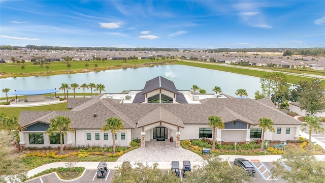 aerial view of residential area with a nearby body of water
