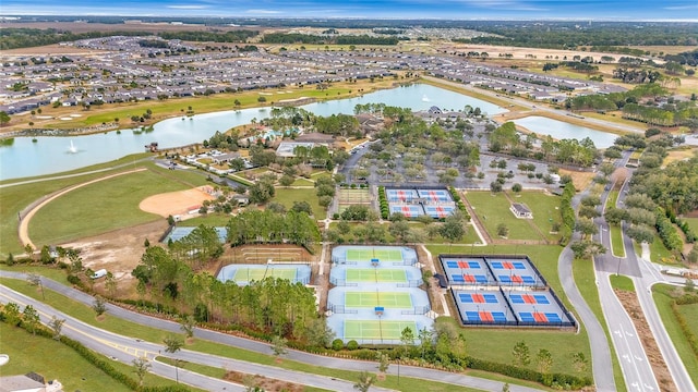 aerial overview of property's location featuring a nearby body of water and nearby suburban area
