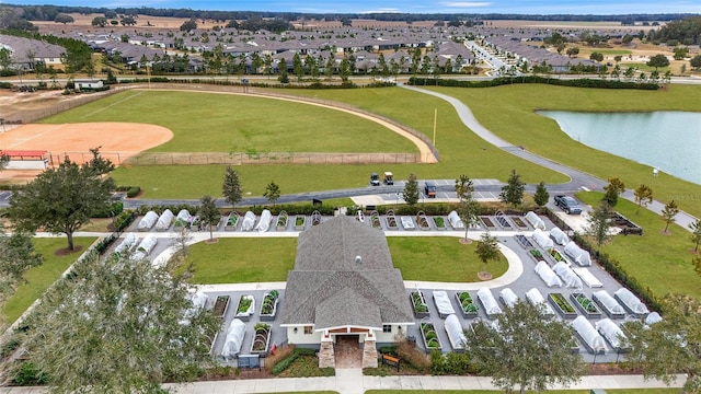 aerial perspective of suburban area with a large body of water