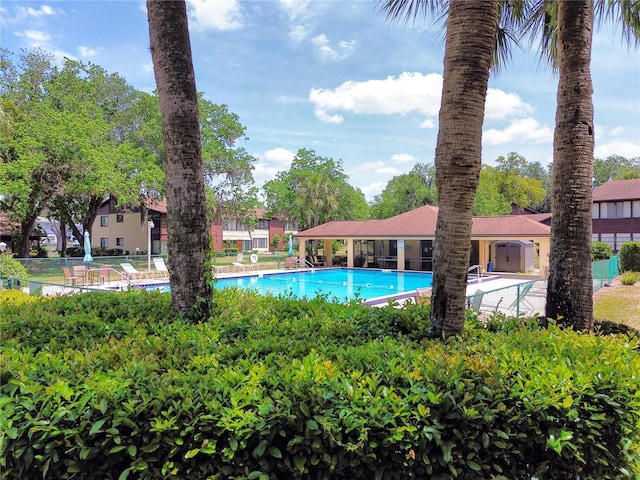 community pool featuring fence