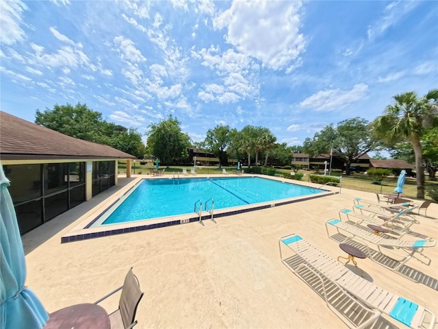 community pool featuring a patio area