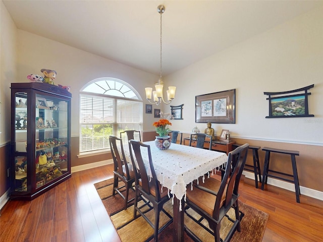 9677 SW 56th Cir, Ocala, FL 34476 - dining area featuring a chandelier, hardwood / wood-style floors, and baseboards