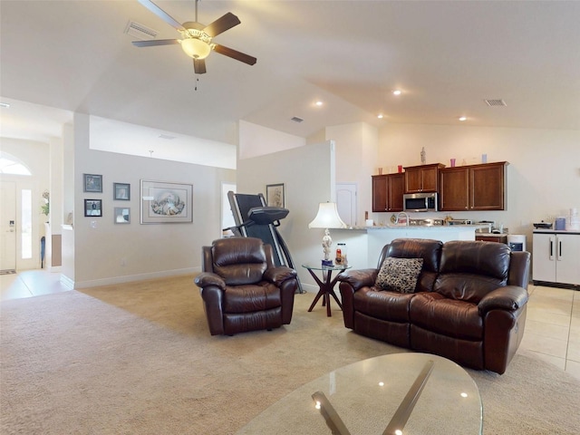 9677 SW 56th Cir, Ocala, FL 34476 - living area with light carpet, a ceiling fan, light tile patterned floors, baseboards, and high vaulted ceiling