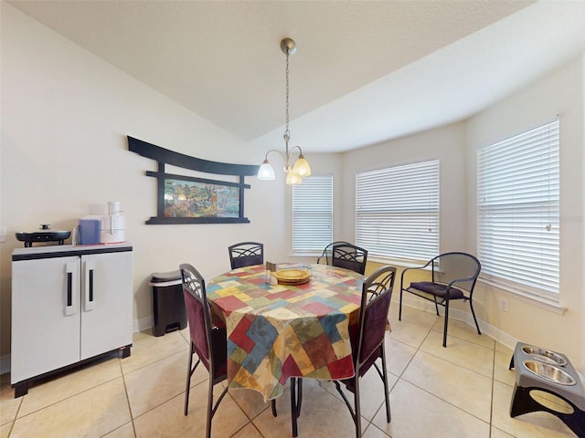 9677 SW 56th Cir, Ocala, FL 34476 - dining room with light tile patterned flooring, a chandelier, lofted ceiling, and baseboards