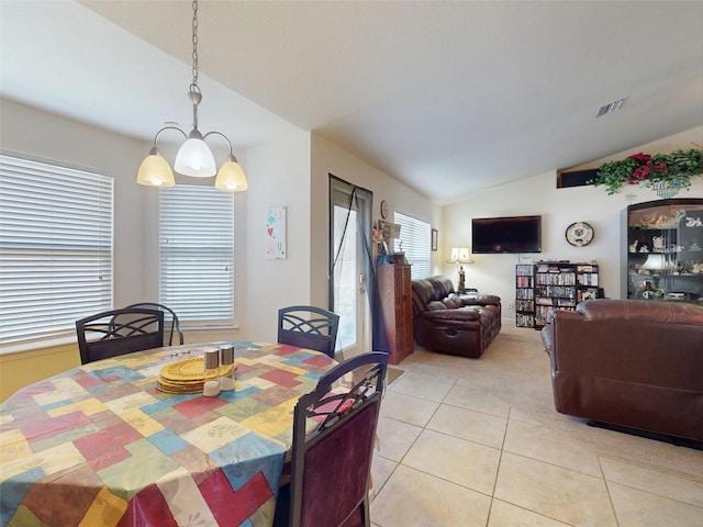 9677 SW 56th Cir, Ocala, FL 34476 - dining space with vaulted ceiling, light colored carpet, and light tile patterned floors