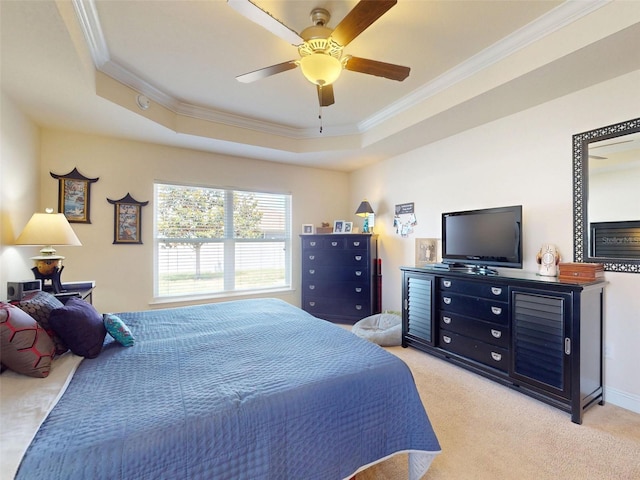 9677 SW 56th Cir, Ocala, FL 34476 - bedroom with ornamental molding, a tray ceiling, light colored carpet, and a ceiling fan