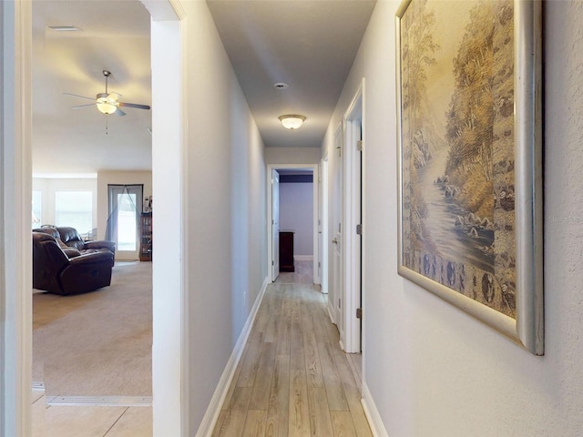 9677 SW 56th Cir, Ocala, FL 34476 - hallway with baseboards and light wood-type flooring
