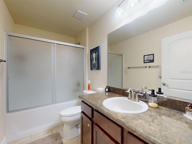 9677 SW 56th Cir, Ocala, FL 34476 - full bath featuring toilet, tile patterned flooring, vanity, and bath / shower combo with glass door