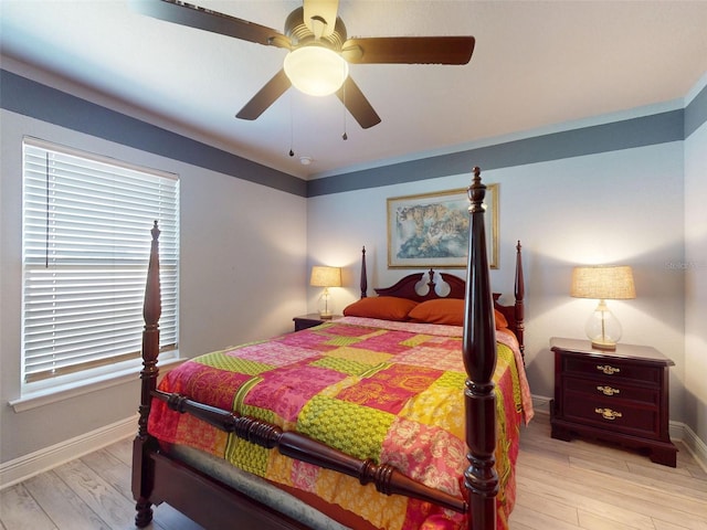 9677 SW 56th Cir, Ocala, FL 34476 - bedroom featuring baseboards, light wood-style flooring, and ceiling fan