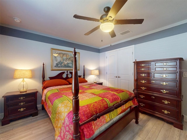 9677 SW 56th Cir, Ocala, FL 34476 - bedroom featuring light wood-type flooring, a closet, and ceiling fan