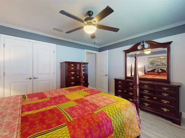 9677 SW 56th Cir, Ocala, FL 34476 - bedroom with light wood finished floors, a closet, a ceiling fan, and baseboards