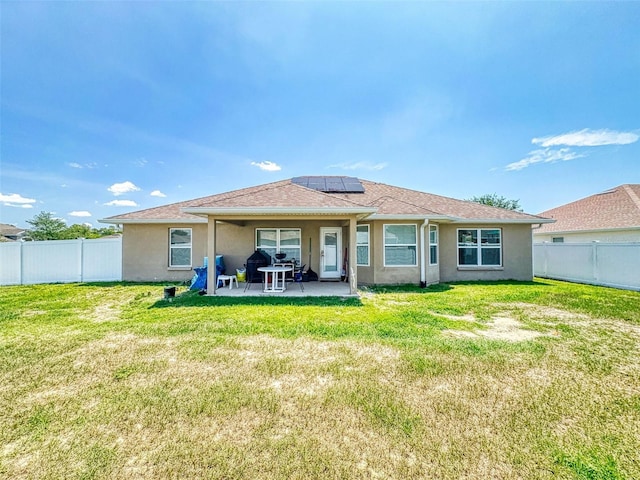 9677 SW 56th Cir, Ocala, FL 34476 - rear view of house featuring solar panels, a patio, and stucco siding