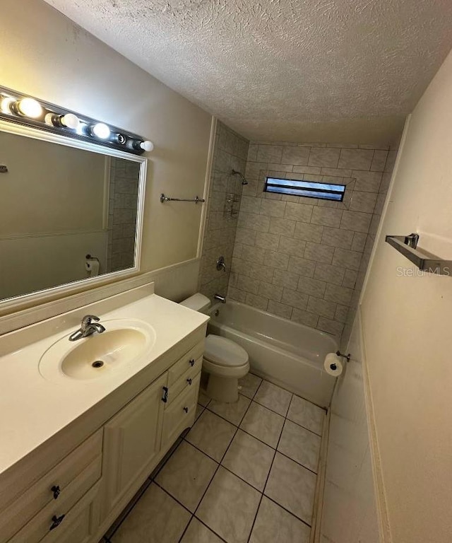 full bath featuring tile patterned flooring, a textured ceiling,  shower combination, vanity, and toilet