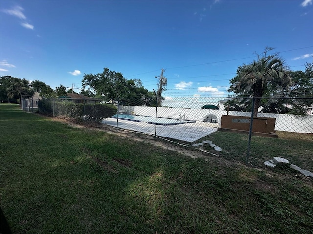 view of yard with a community pool