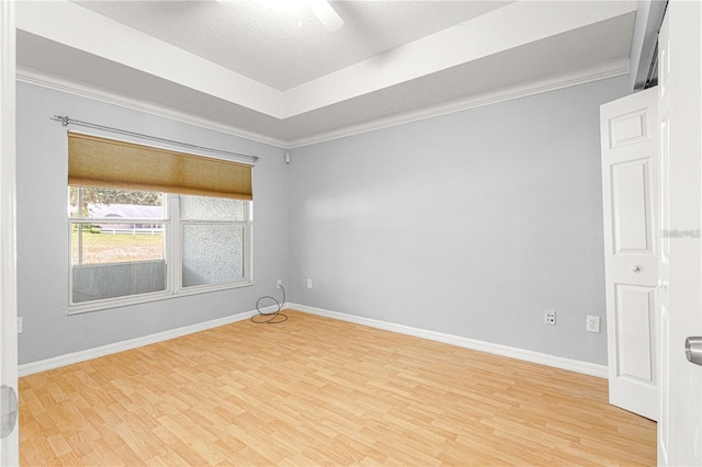 9287 SW 91st Court Rd, Ocala, FL 34481 - unfurnished room featuring light wood-type flooring, baseboards, a ceiling fan, ornamental molding, and a textured ceiling