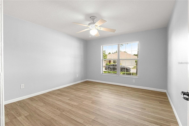 9287 SW 91st Court Rd, Ocala, FL 34481 - unfurnished room with light wood-type flooring, baseboards, and a ceiling fan