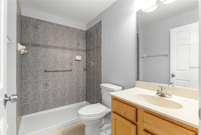 9287 SW 91st Court Rd, Ocala, FL 34481 - full bathroom featuring a textured ceiling, toilet, tiled shower, vanity, and tile patterned flooring