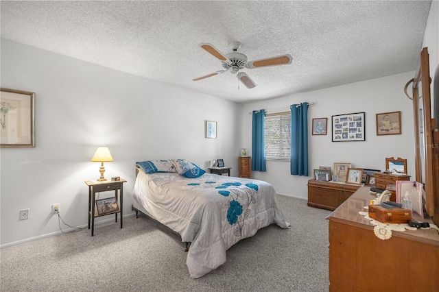 bedroom with carpet, ceiling fan, a textured ceiling, and baseboards
