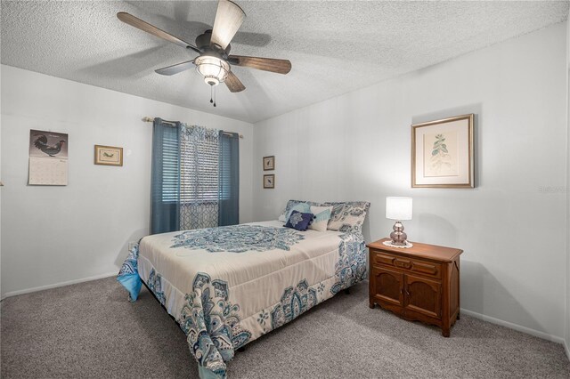 bedroom with light colored carpet, a textured ceiling, baseboards, and a ceiling fan