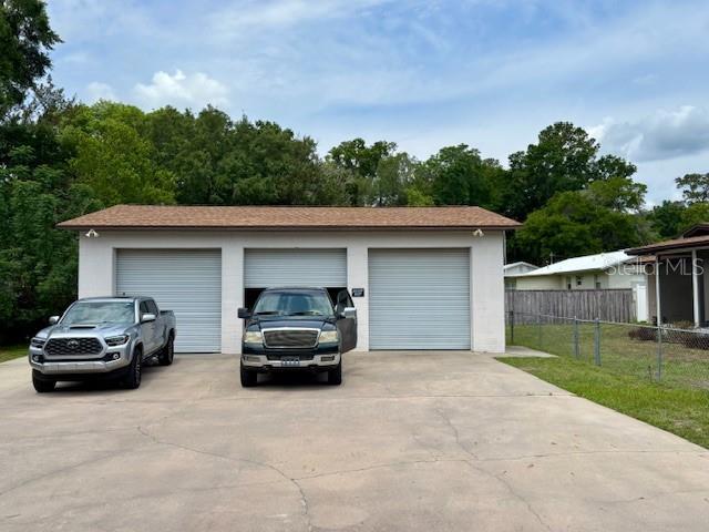 detached garage with fence