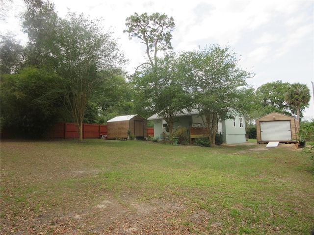 5949 SE 164th Ct, Ocklawaha, FL 32179 - view of yard with a storage unit and an outdoor structure