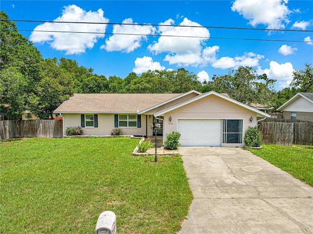 10739 SE 44th Ter, Belleview, FL 34420 - single story home with driveway, an attached garage, and stucco siding