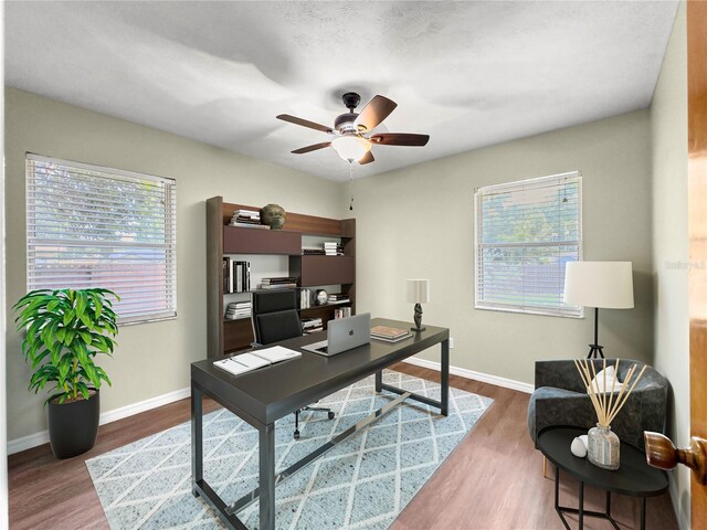 10739 SE 44th Ter, Belleview, FL 34420 - office featuring ceiling fan, wood finished floors, and baseboards