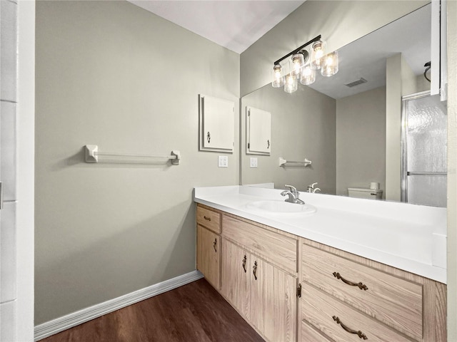 10739 SE 44th Ter, Belleview, FL 34420 - bathroom featuring wood finished floors, baseboards, and vanity
