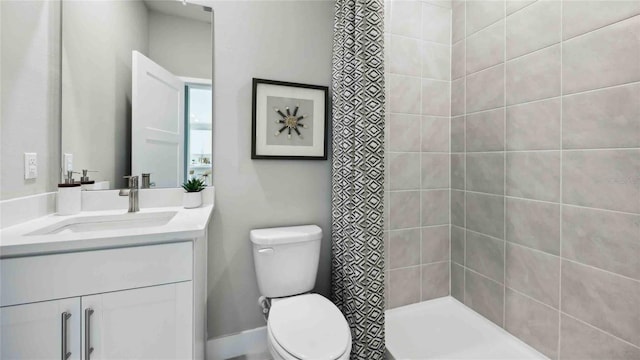 full bathroom with toilet, vanity, and a shower