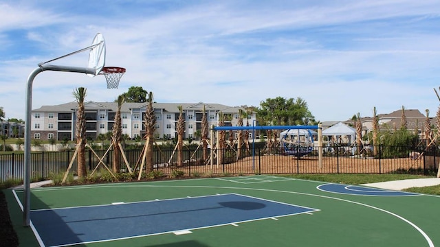 view of basketball court with a residential view, community basketball court, fence, and a gazebo