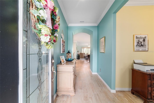 6868 SW 95th Cir, Ocala, FL 34481 - hall featuring arched walkways, ornamental molding, light wood-style flooring, and baseboards