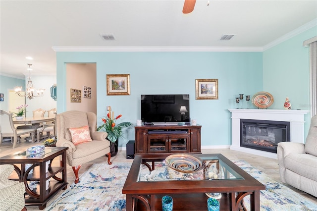 6868 SW 95th Cir, Ocala, FL 34481 - living room with crown molding, a chandelier, baseboards, a ceiling fan, and a glass covered fireplace