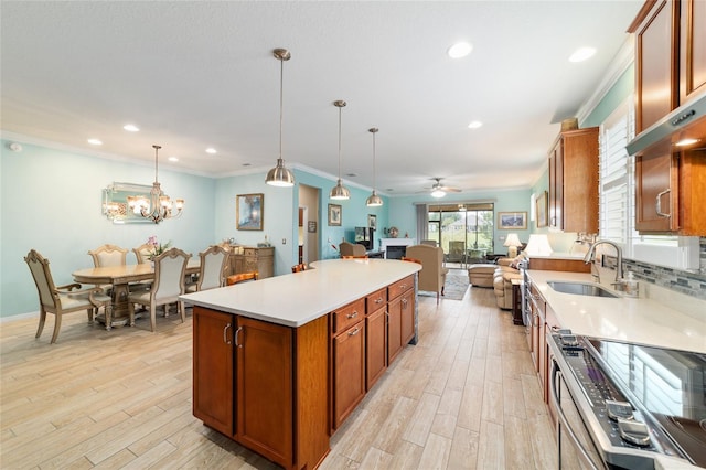 6868 SW 95th Cir, Ocala, FL 34481 - kitchen featuring a sink, stainless steel range with electric stovetop, brown cabinets, open floor plan, and light wood-type flooring