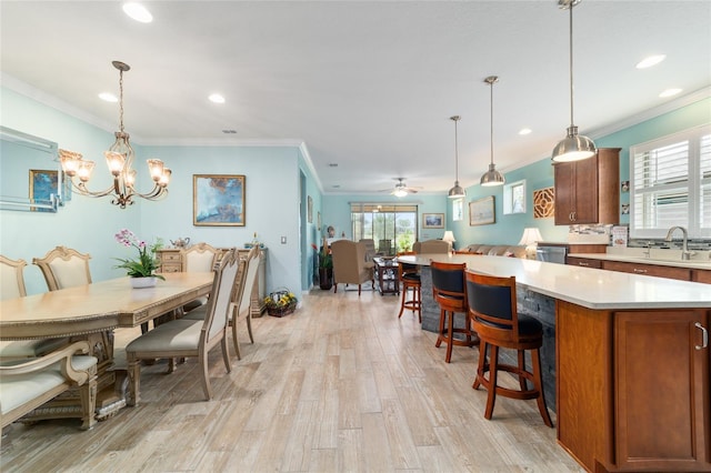 6868 SW 95th Cir, Ocala, FL 34481 - dining space with crown molding, light wood-type flooring, recessed lighting, a chandelier, and a ceiling fan