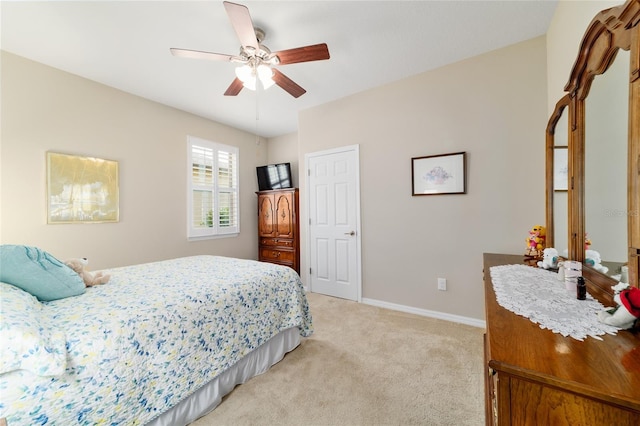 6868 SW 95th Cir, Ocala, FL 34481 - bedroom featuring light carpet, baseboards, and a ceiling fan