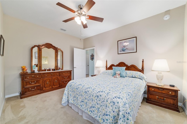 6868 SW 95th Cir, Ocala, FL 34481 - bedroom with light colored carpet, baseboards, and a ceiling fan