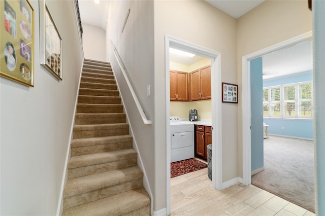 6868 SW 95th Cir, Ocala, FL 34481 - staircase with washer / clothes dryer, wood finished floors, and baseboards