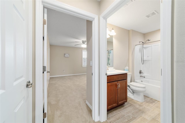 6868 SW 95th Cir, Ocala, FL 34481 - full bathroom with vanity, toilet, ceiling fan, washtub / shower combination, and baseboards