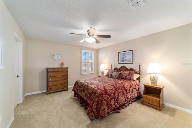 6868 SW 95th Cir, Ocala, FL 34481 - bedroom featuring light carpet, baseboards, a ceiling fan, and a textured ceiling