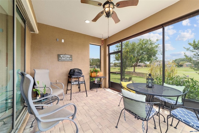 6868 SW 95th Cir, Ocala, FL 34481 - sunroom / solarium with a ceiling fan and golf course view