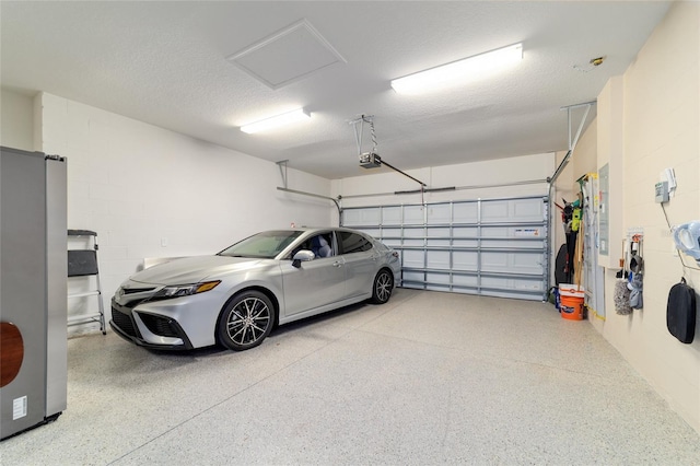 6868 SW 95th Cir, Ocala, FL 34481 - garage featuring a garage door opener and concrete block wall