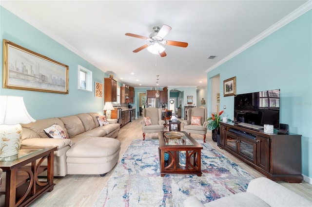 6868 SW 95th Cir, Ocala, FL 34481 - living area with a ceiling fan, ornamental molding, and light wood-style floors