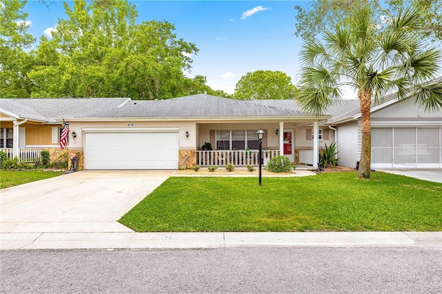 8874 SW 95th St Unit E, Ocala, FL 34481 - ranch-style home featuring covered porch, an attached garage, stone siding, and a front yard
