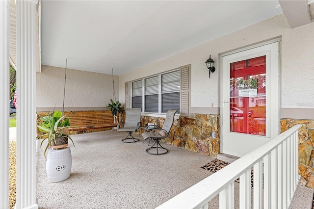 8874 SW 95th St Unit E, Ocala, FL 34481 - view of patio featuring covered porch